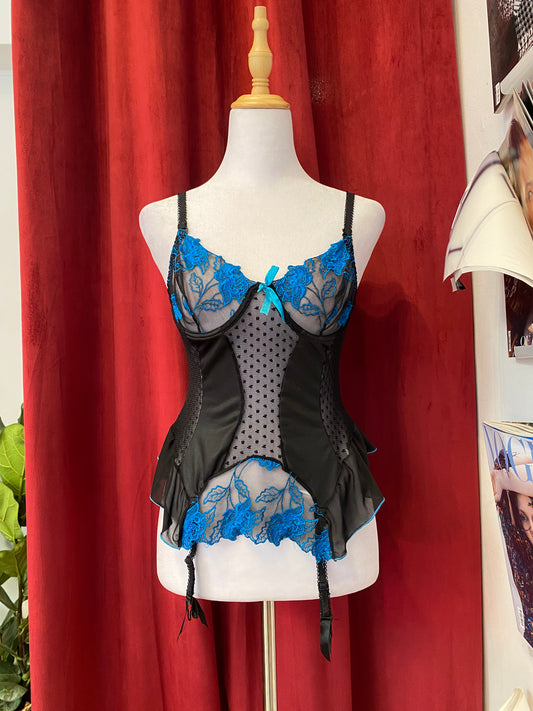 Black corset with blue hints and lace up details in the back