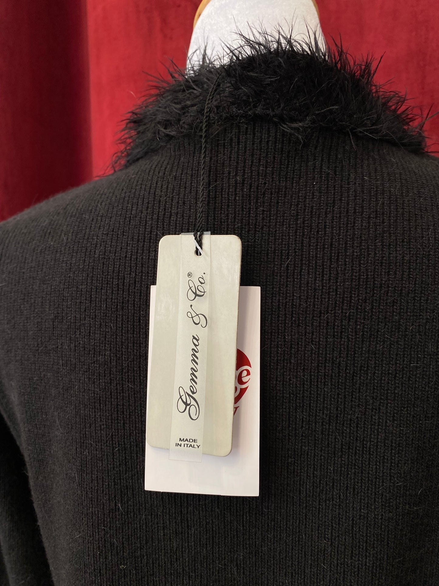 Black knitted top with fur details on collar and sleeves