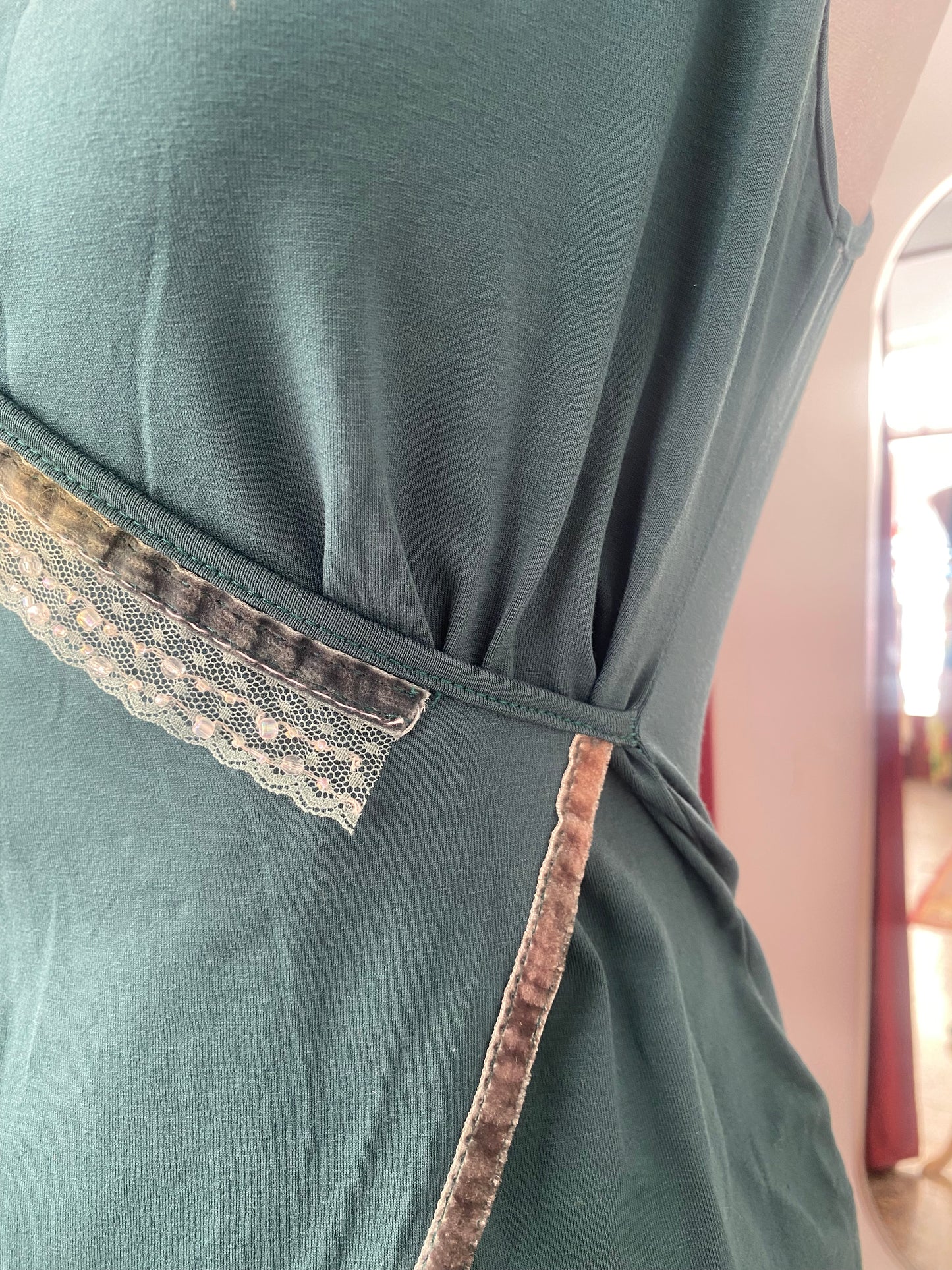 Brand new deep green top with sequin details