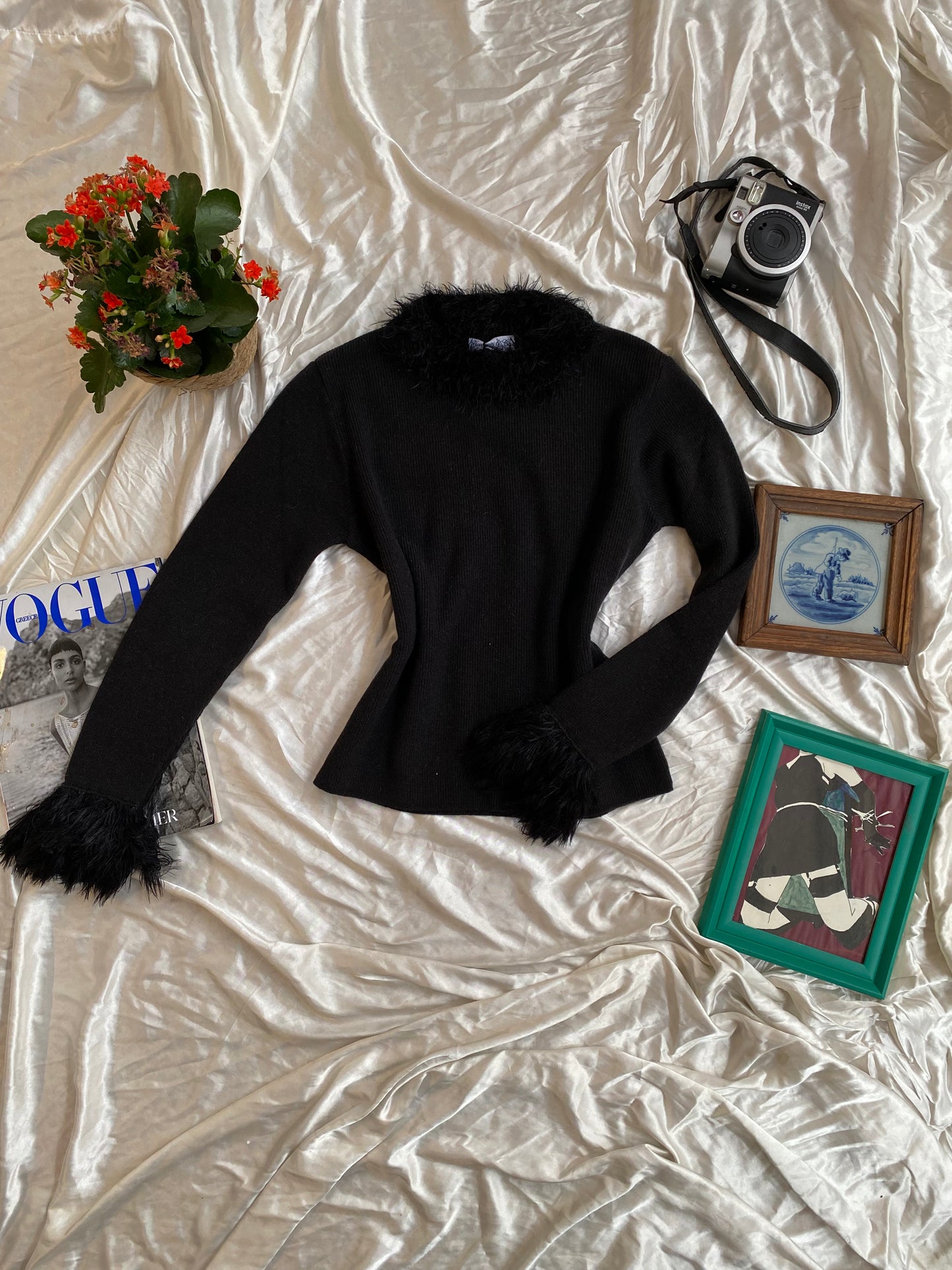 Black knitted top with fur details on collar and sleeves