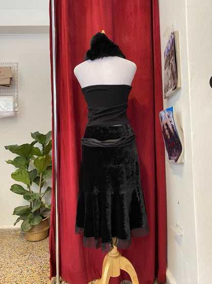 Black velvet midi skirt with complementary silk belt