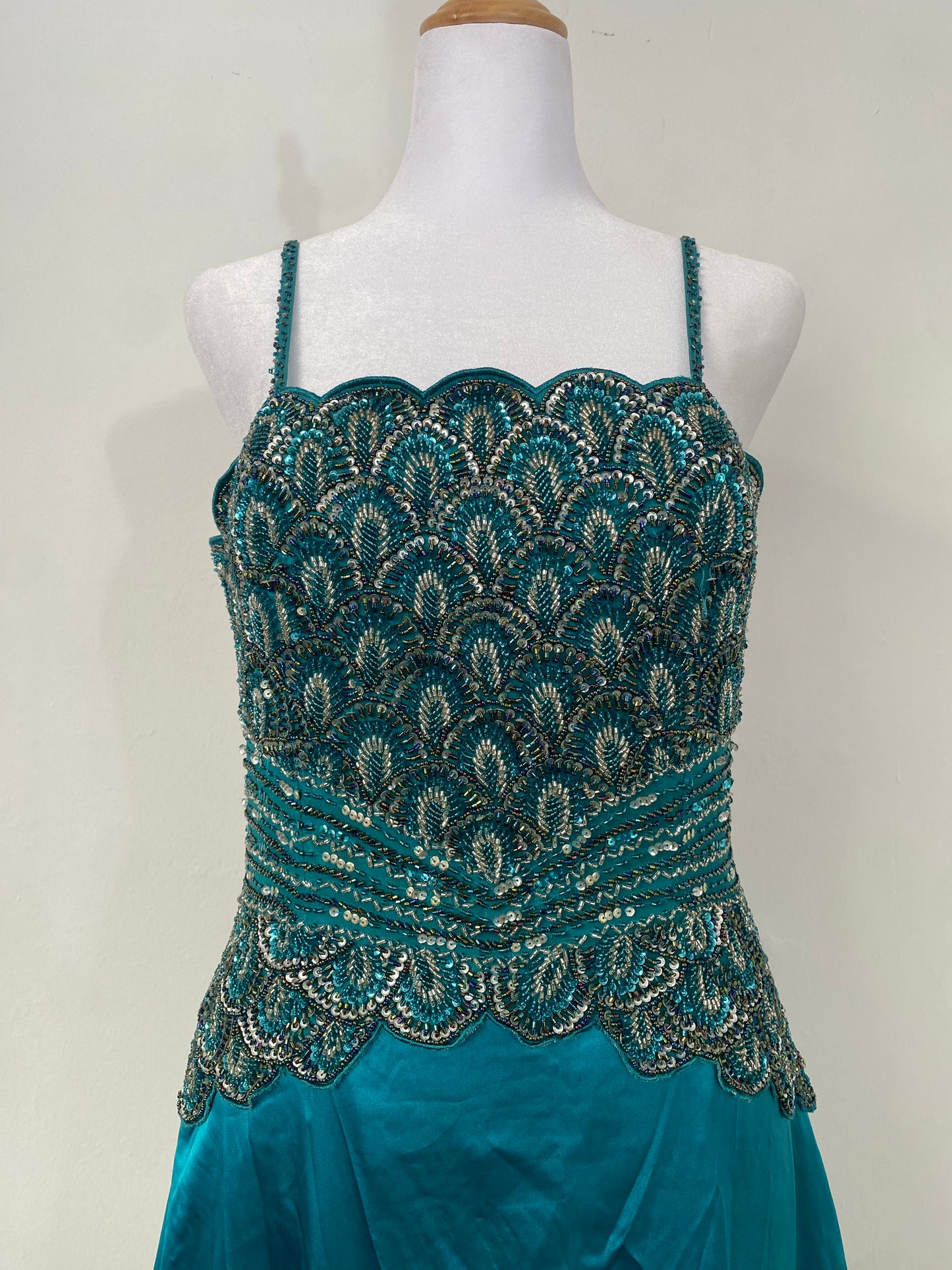 Brand new petrol gown with all over handbeaded details on the bust