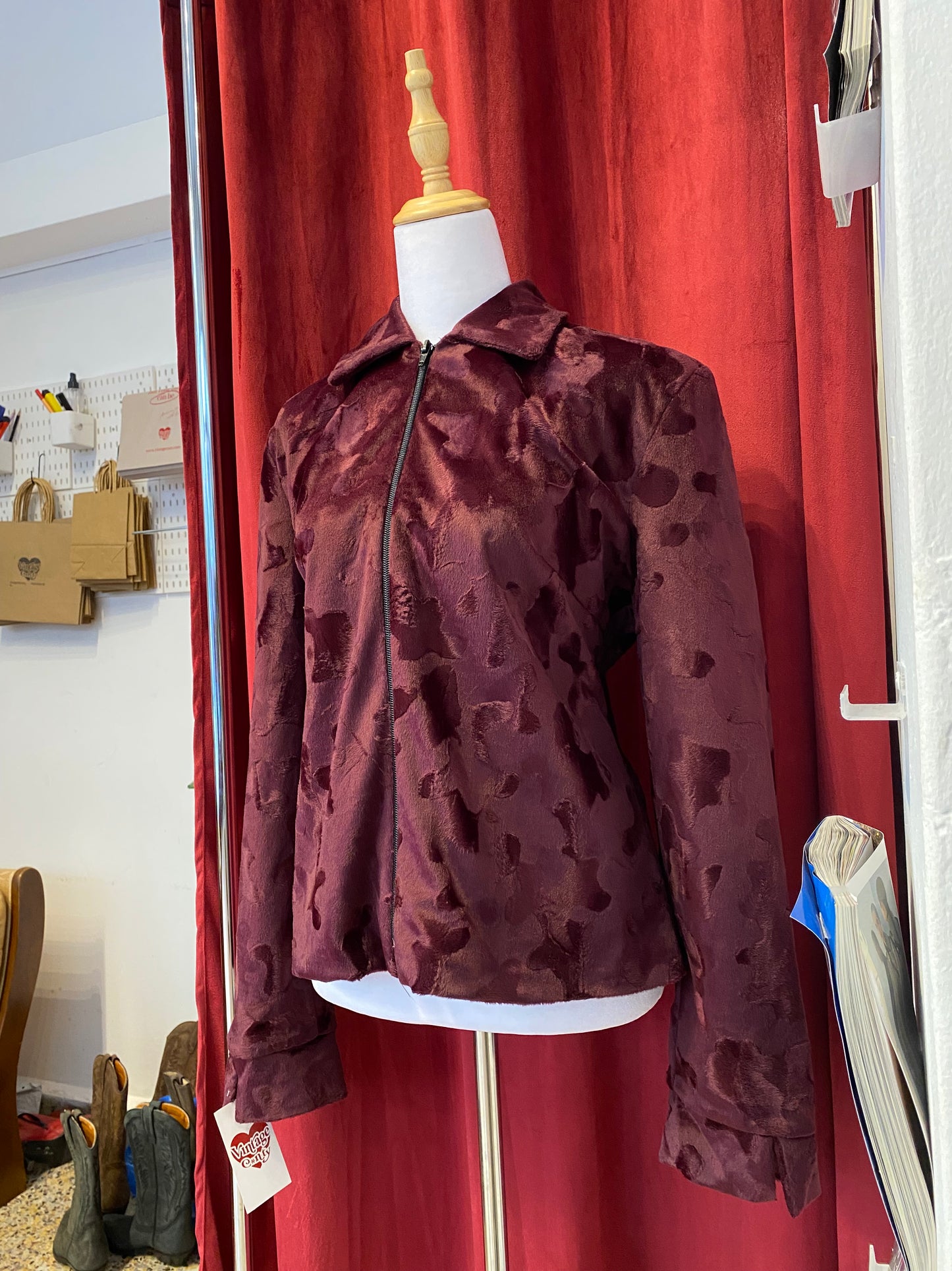 Deep burgundy faux fur jacket with cow print details