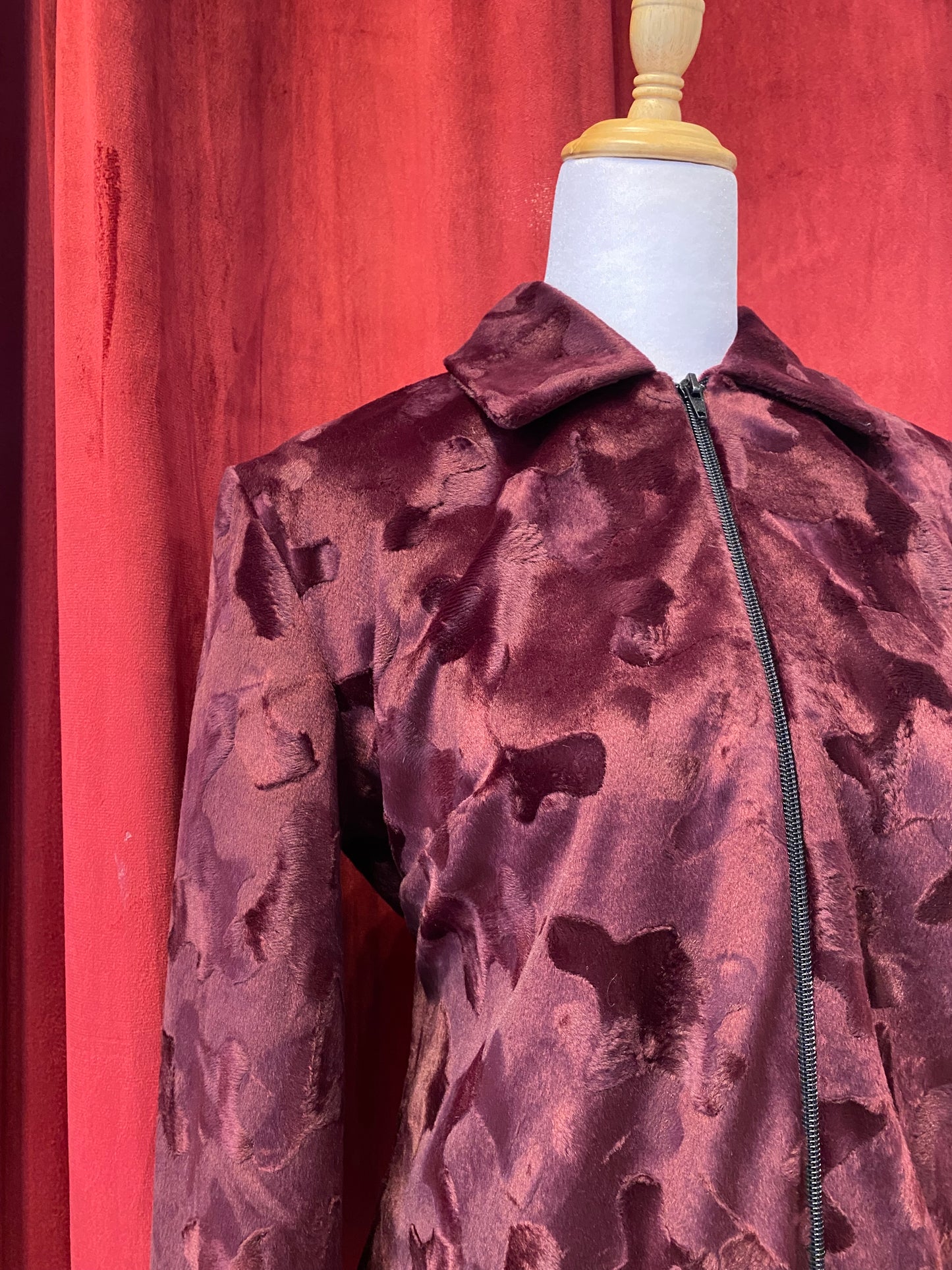 Deep burgundy faux fur jacket with cow print details