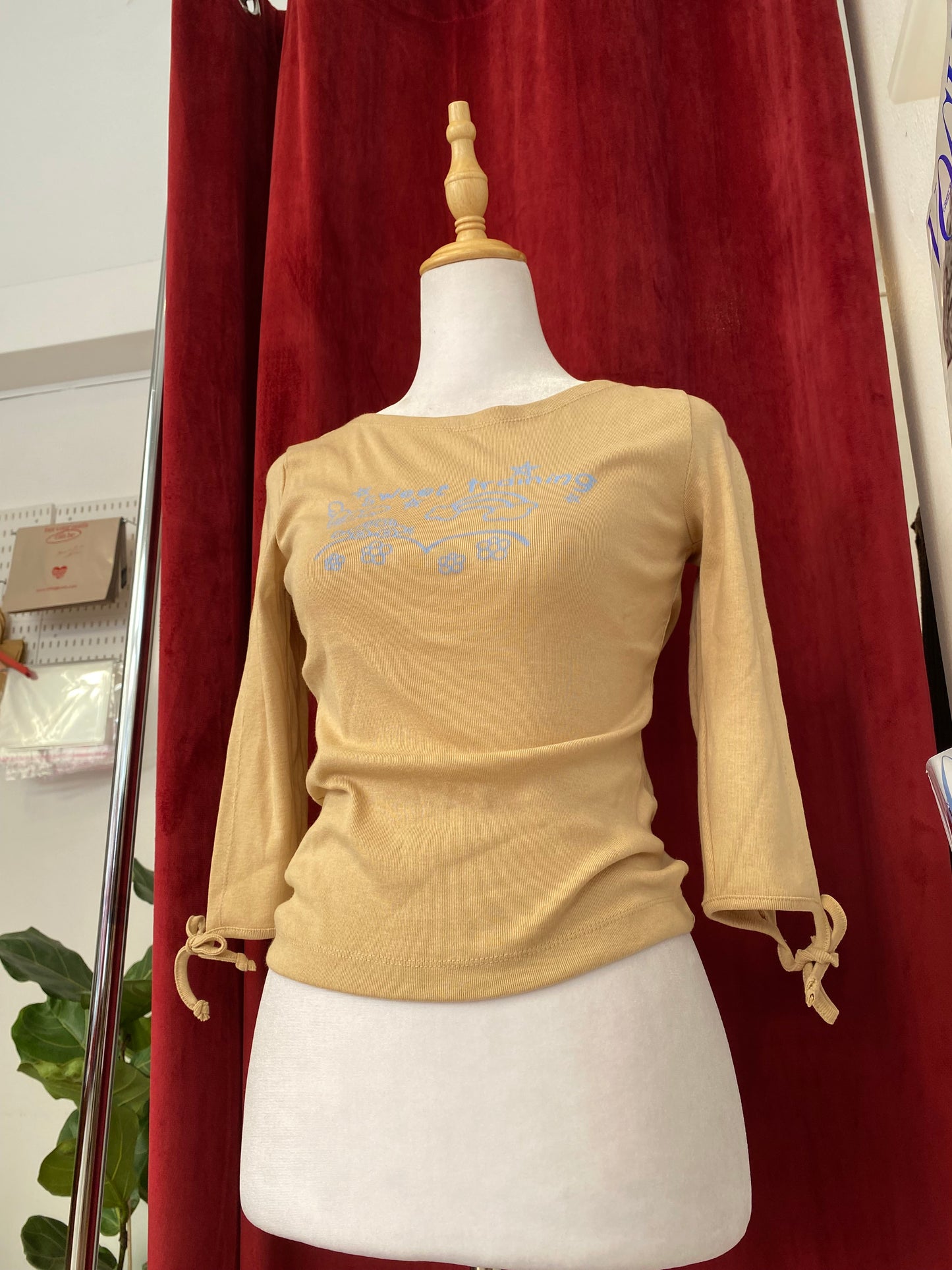 Beige cotton top with graphic design