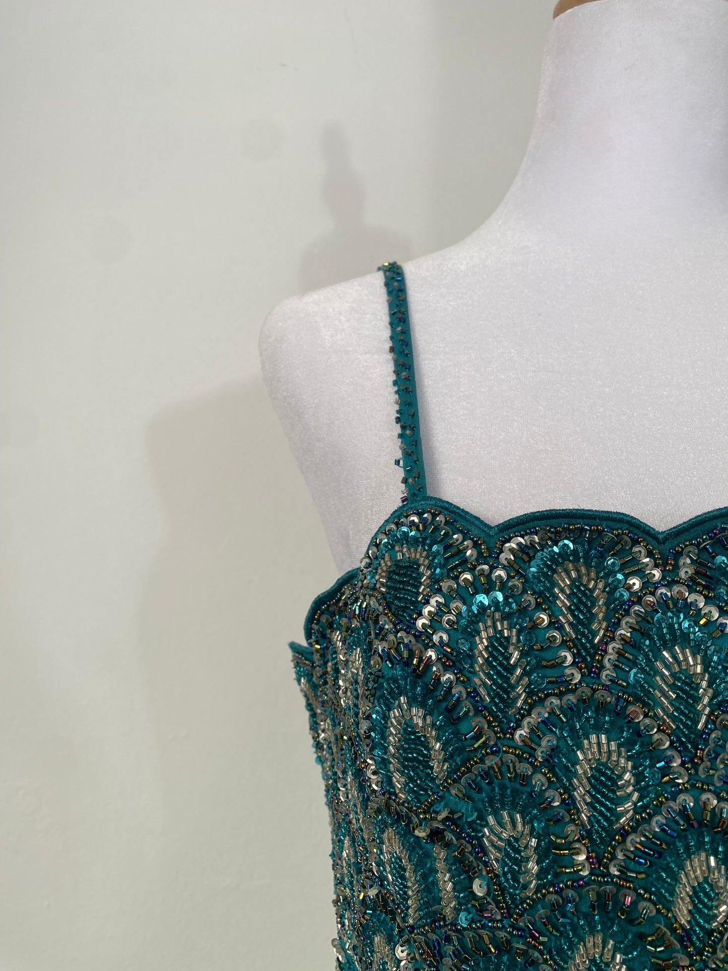 Brand new petrol gown with all over handbeaded details on the bust