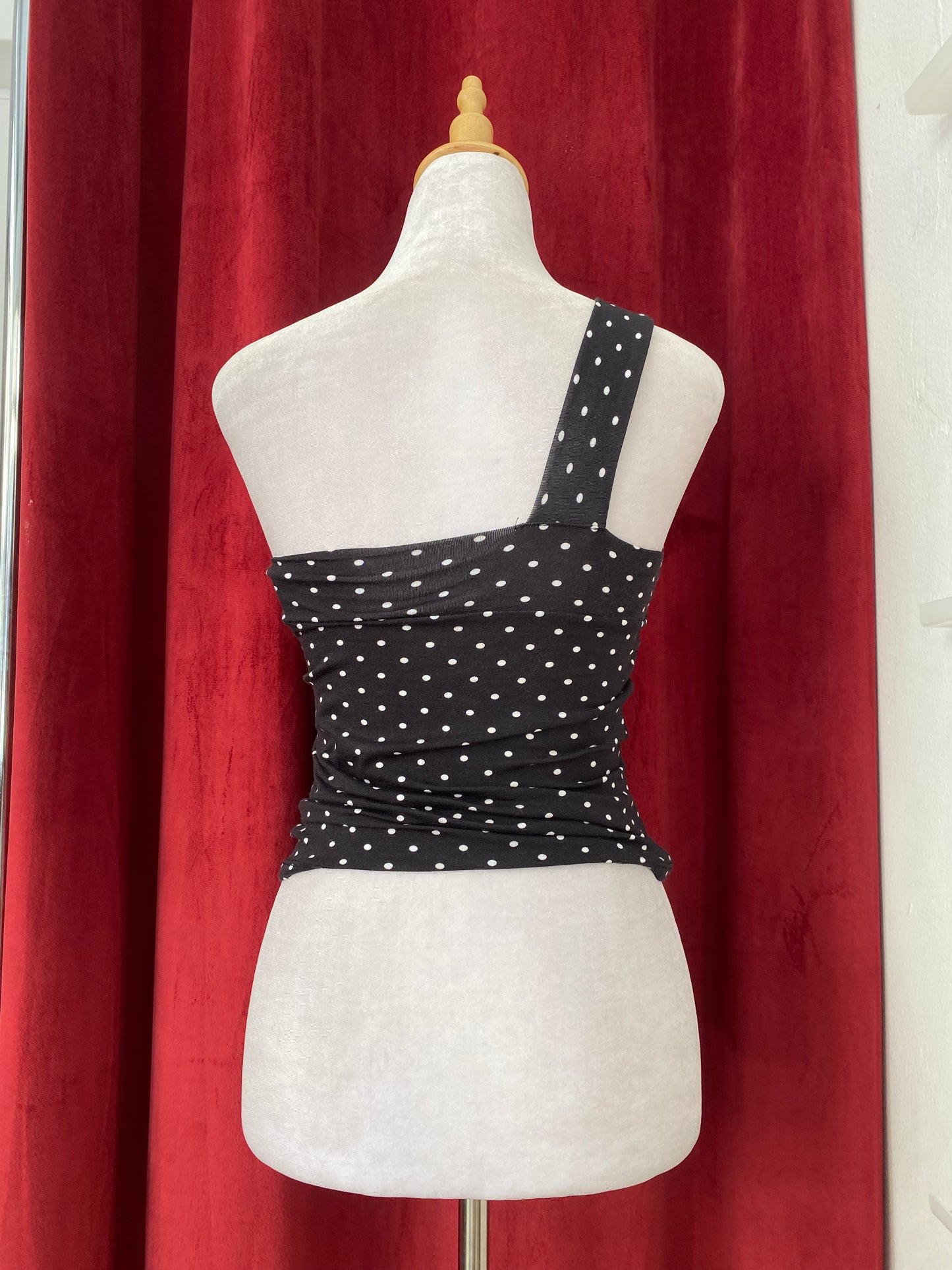 Black one shoulder polka dot top