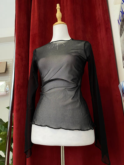 Sheer black top with rhinestone details