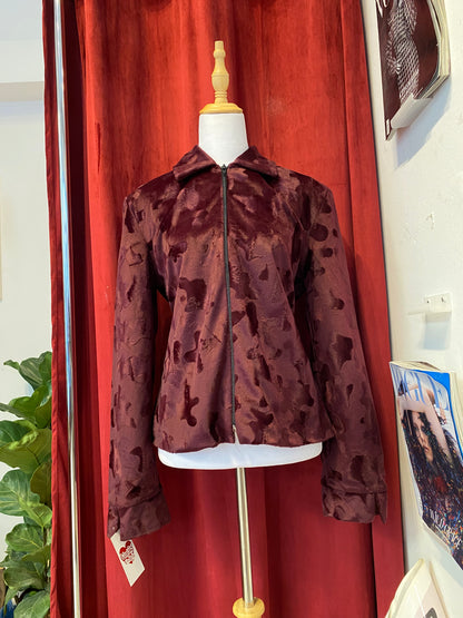 Deep burgundy faux fur jacket with cow print details