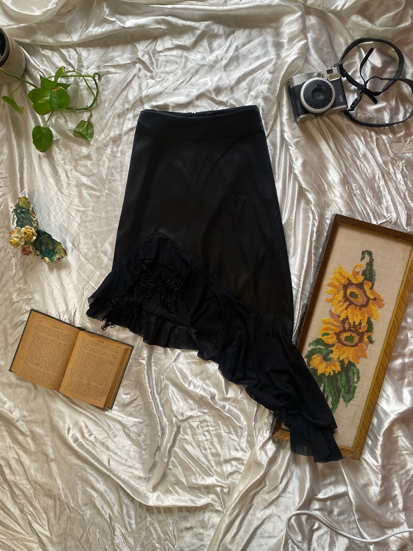 Brand new black asymmetrical satin skirt with fringe details