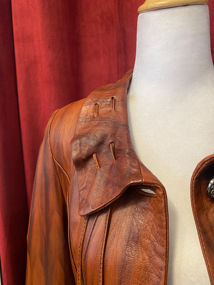 Elegant brown leather coat with intricate details 🥃