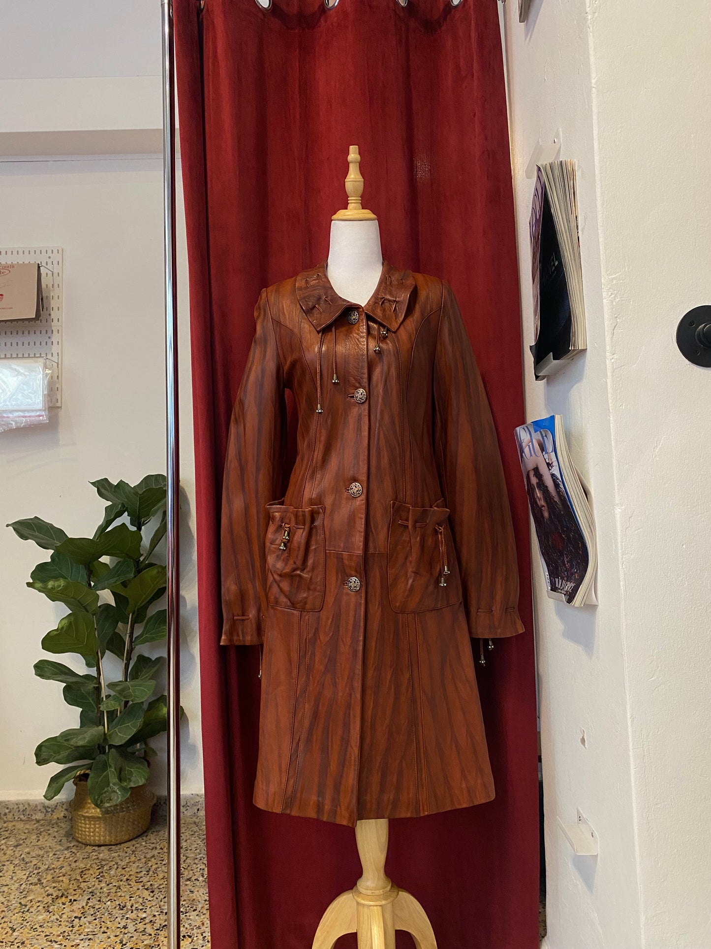 Elegant brown leather coat with intricate details 🥃