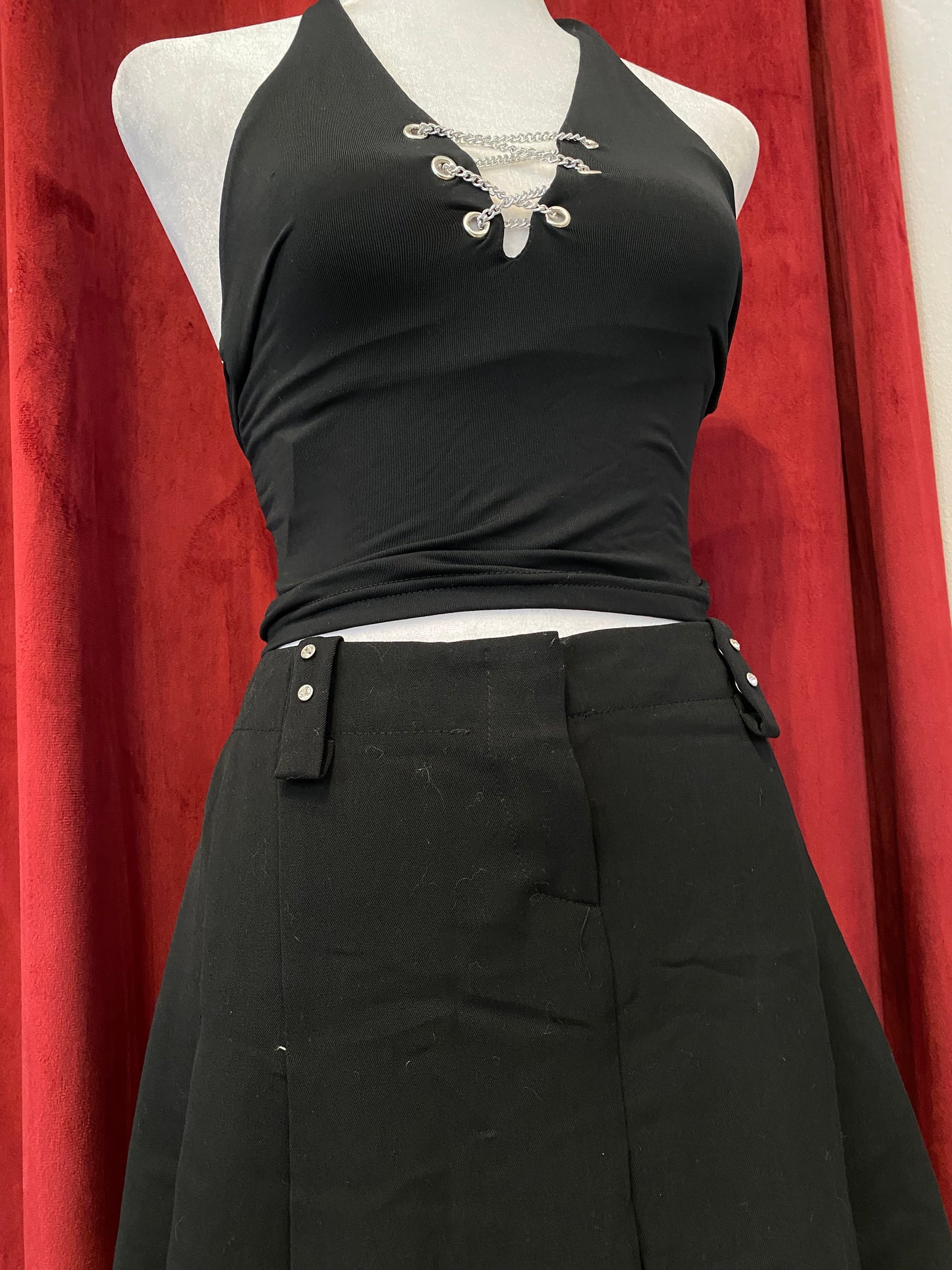 Mini black ruffled skirt with rhinestone details