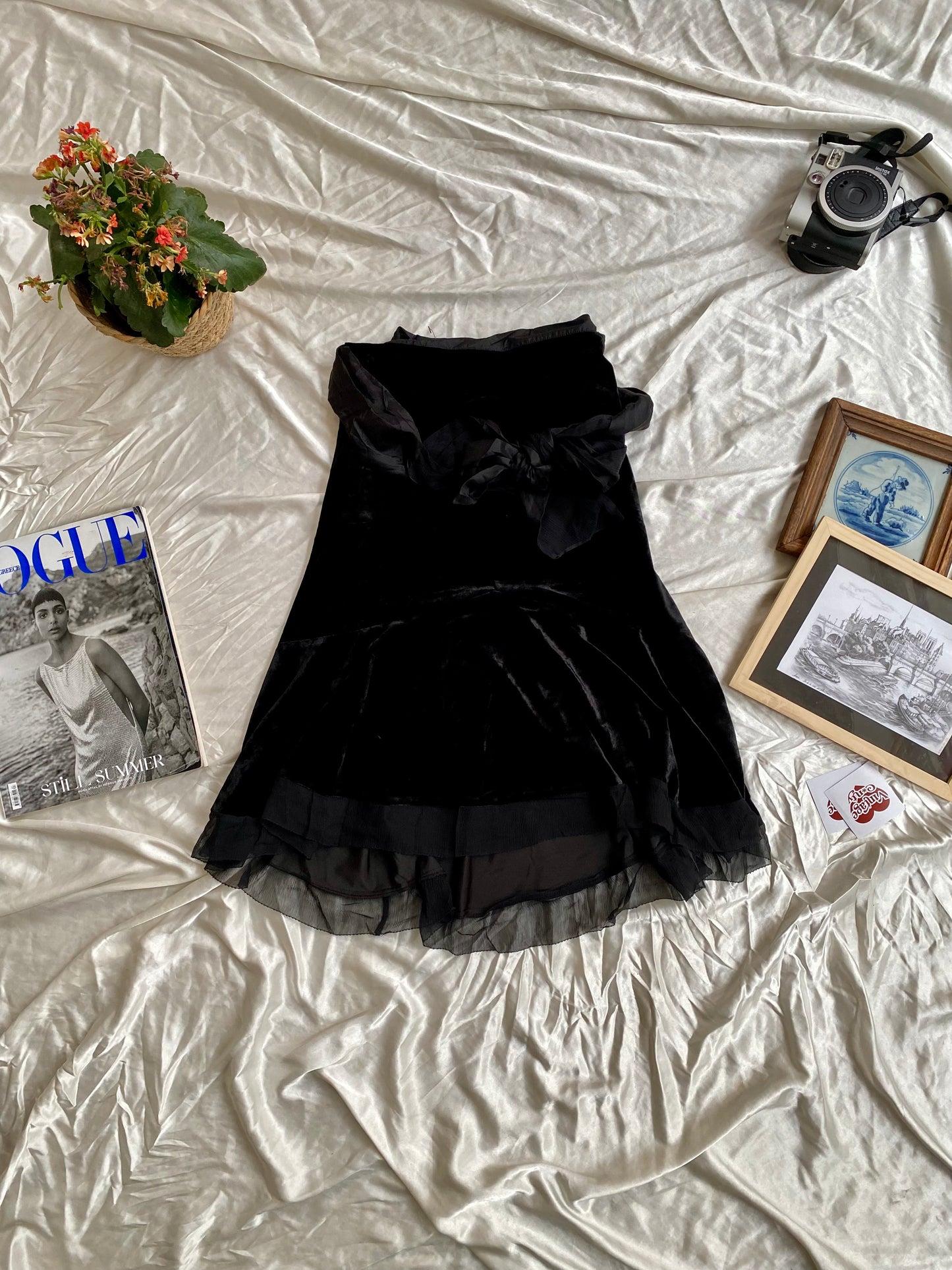 Black velvet midi skirt with complementary silk belt
