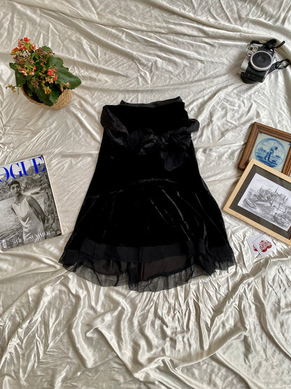 Black velvet midi skirt with complementary silk belt