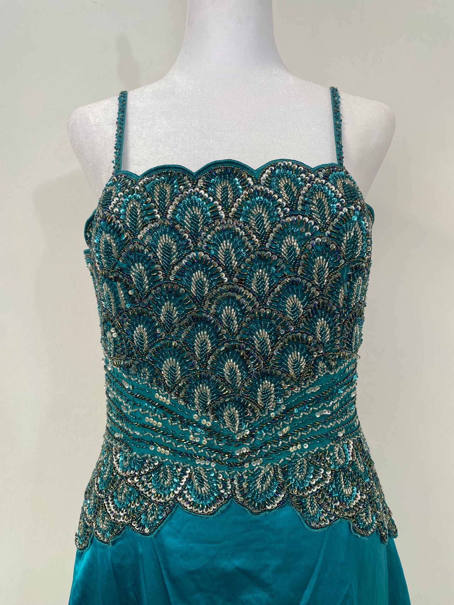 Brand new petrol gown with all over handbeaded details on the bust