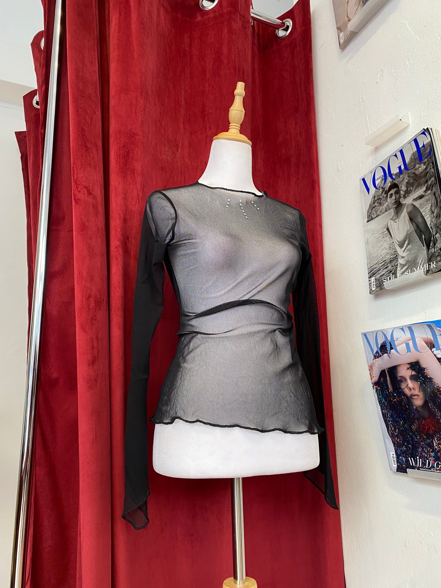 Sheer black top with rhinestone details