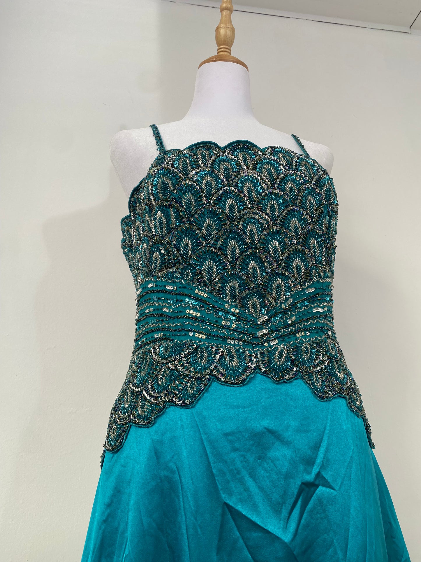 Brand new petrol gown with all over handbeaded details on the bust