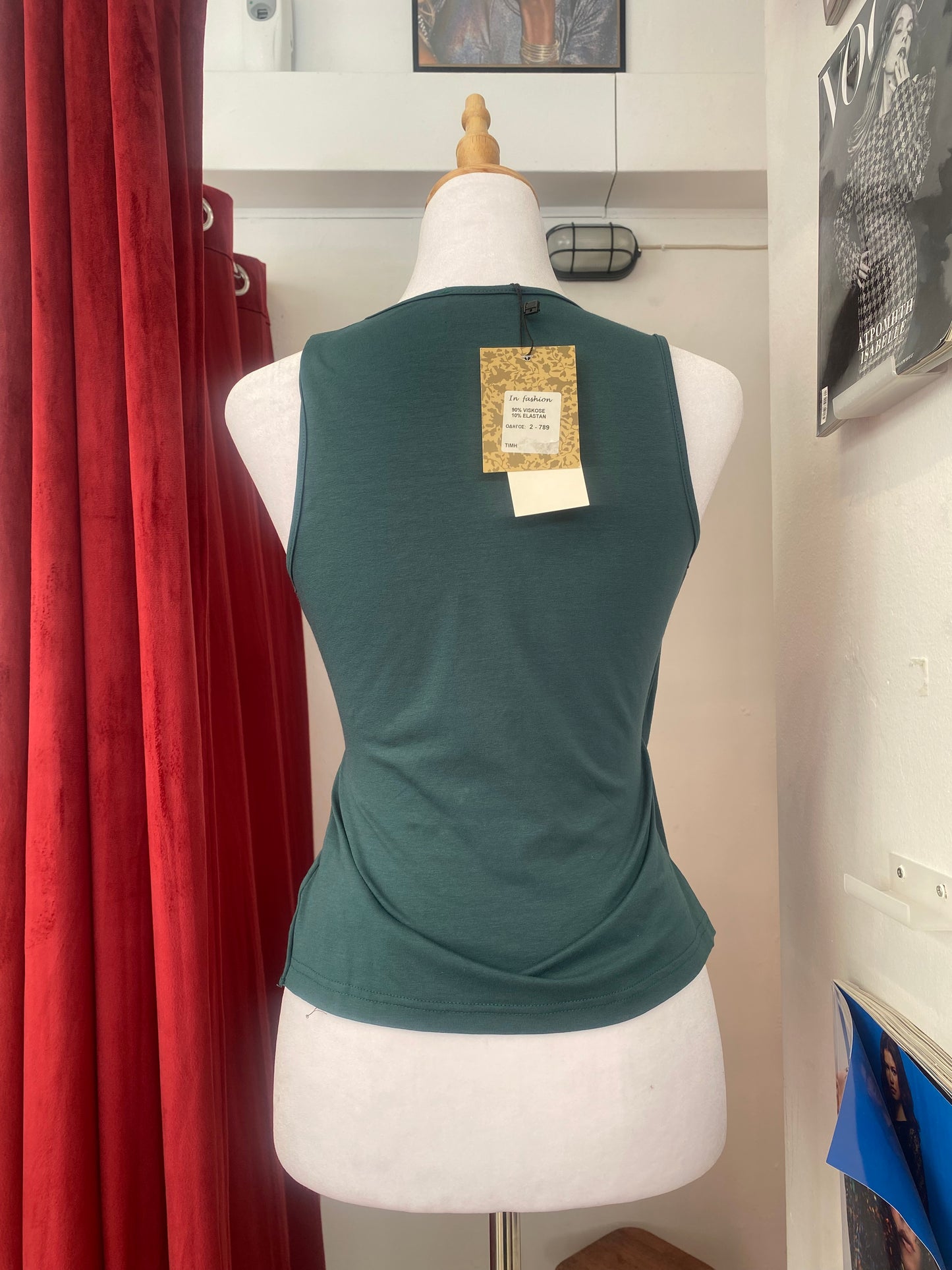 Brand new deep green top with sequin details