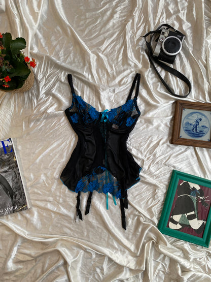 Black corset with blue hints and lace up details in the back