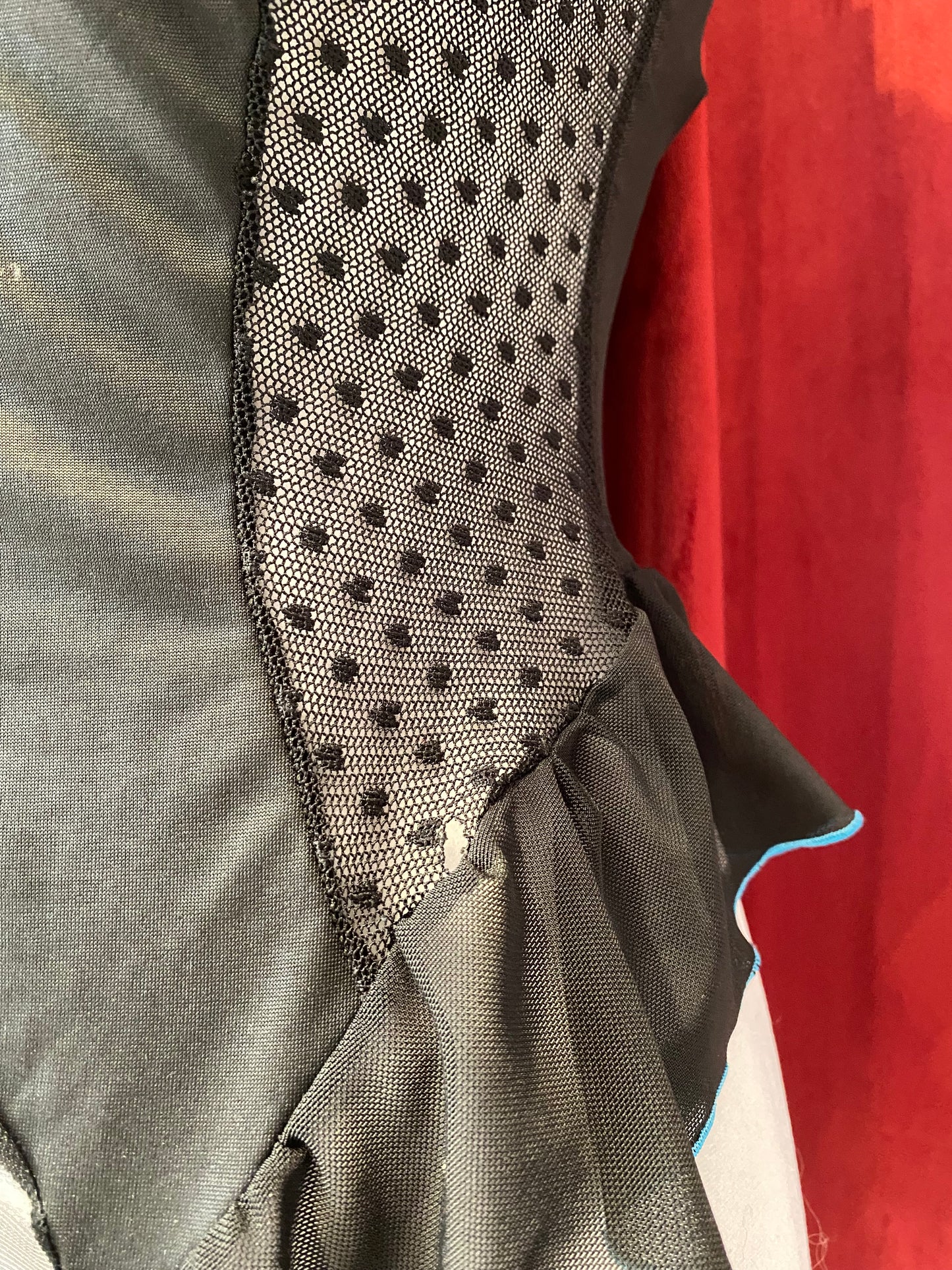 Black corset with blue hints and lace up details in the back