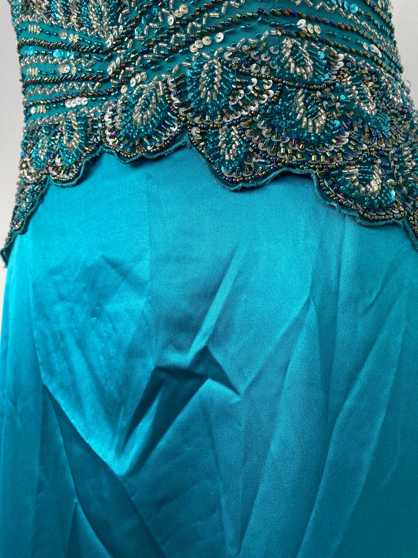 Brand new petrol gown with all over handbeaded details on the bust
