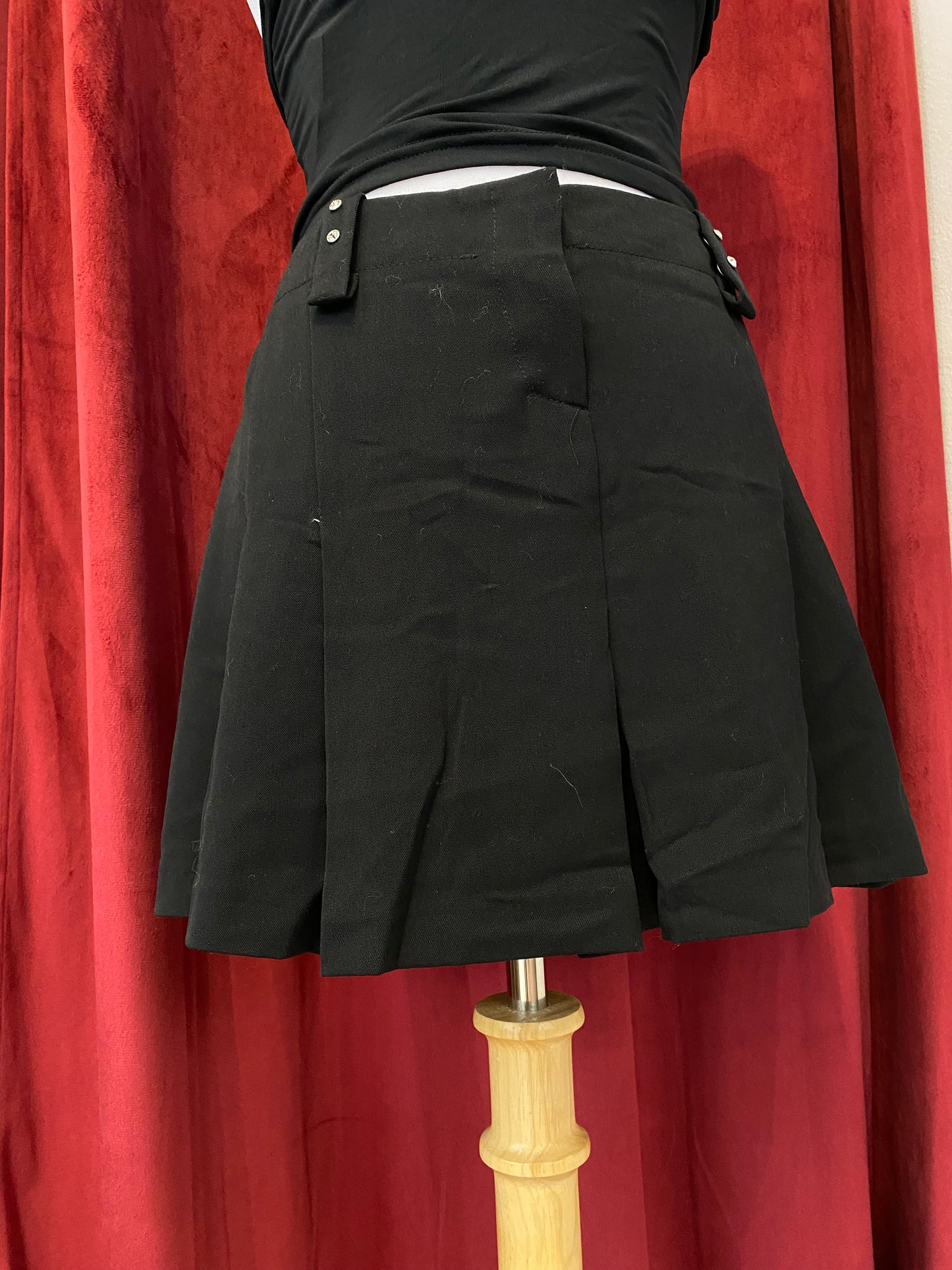 Mini black ruffled skirt with rhinestone details