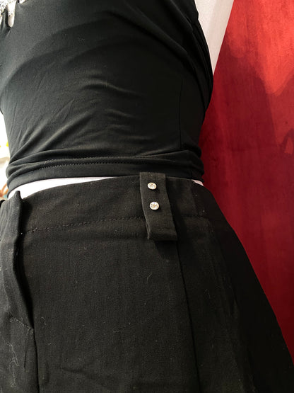 Mini black ruffled skirt with rhinestone details