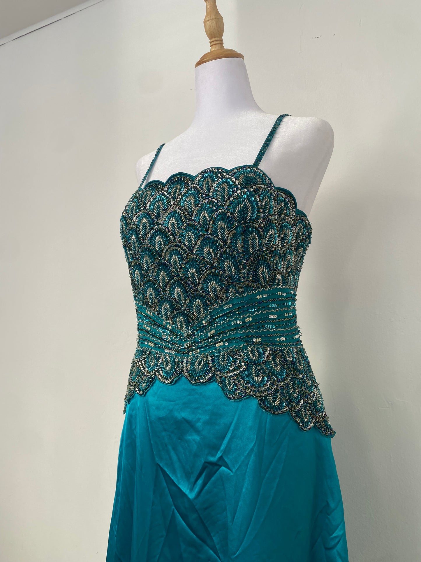 Brand new petrol gown with all over handbeaded details on the bust