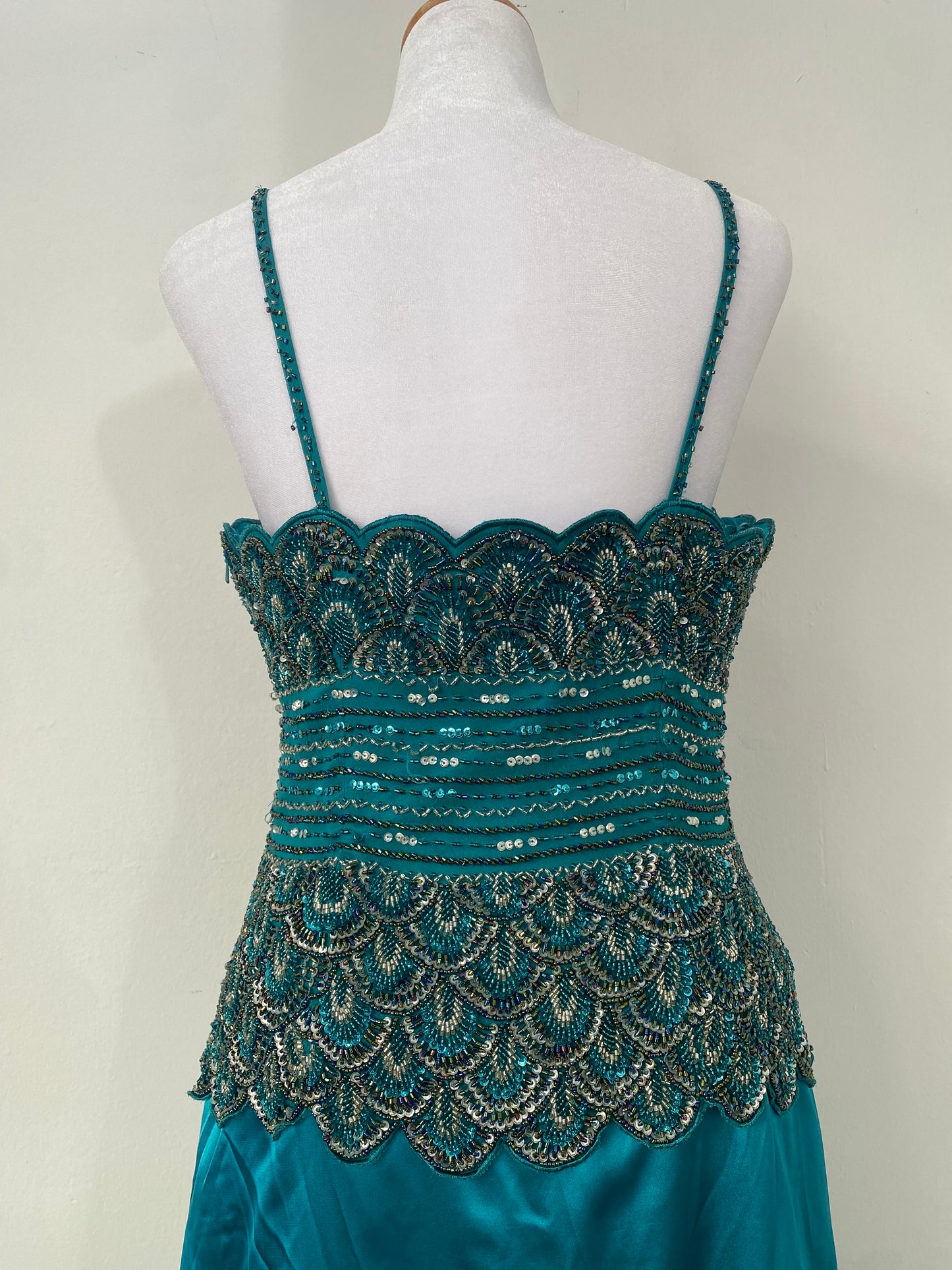 Brand new petrol gown with all over handbeaded details on the bust