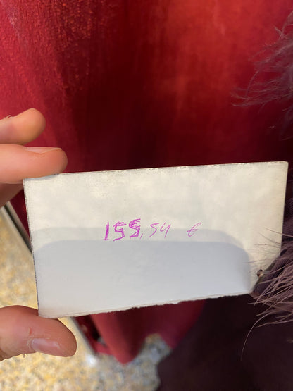 Brand new deep purple gown with feather bust