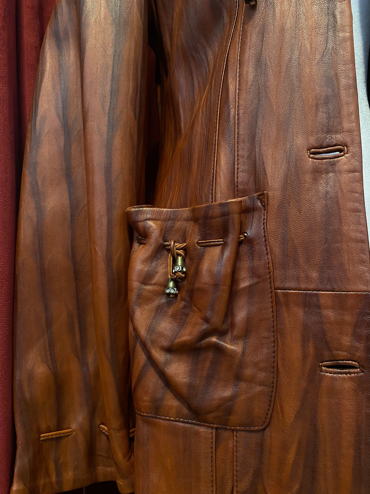 Elegant brown leather coat with intricate details 🥃