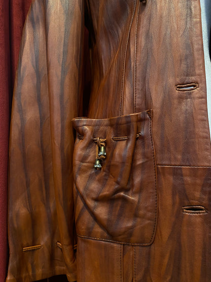 Elegant brown leather coat with intricate details 🥃