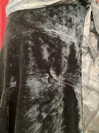 Black velvet midi skirt with complementary silk belt