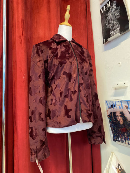 Deep burgundy faux fur jacket with cow print details