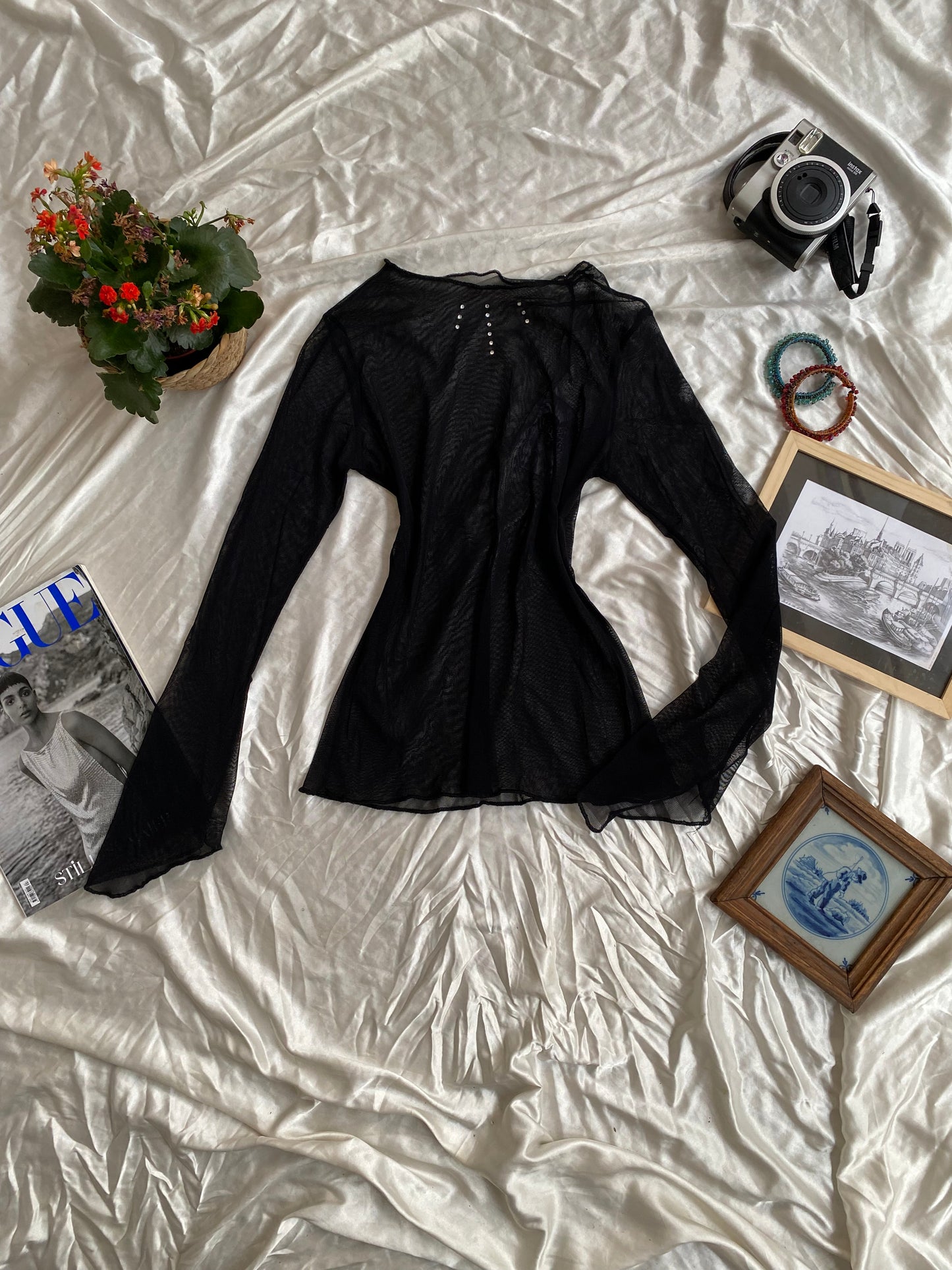 Sheer black top with rhinestone details