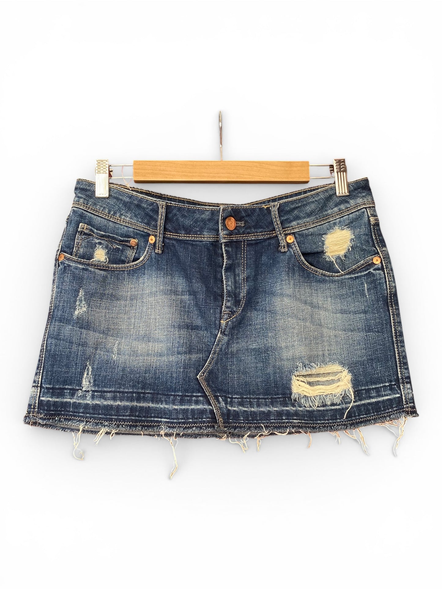 Distressed mini denim skirt