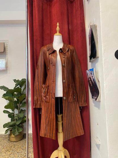 Elegant brown leather coat with intricate details 🥃