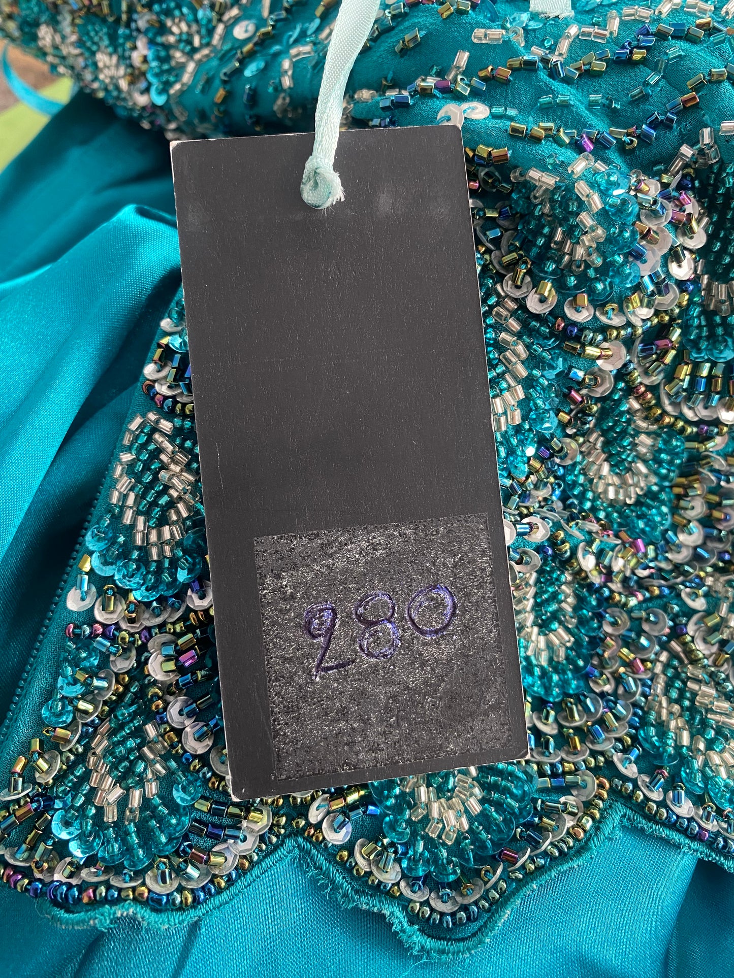 Brand new petrol gown with all over handbeaded details on the bust