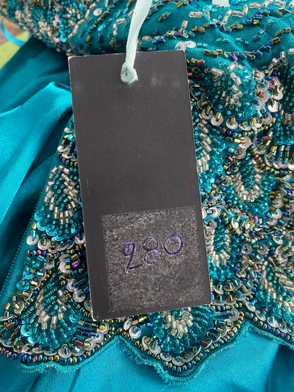 Brand new petrol gown with all over handbeaded details on the bust