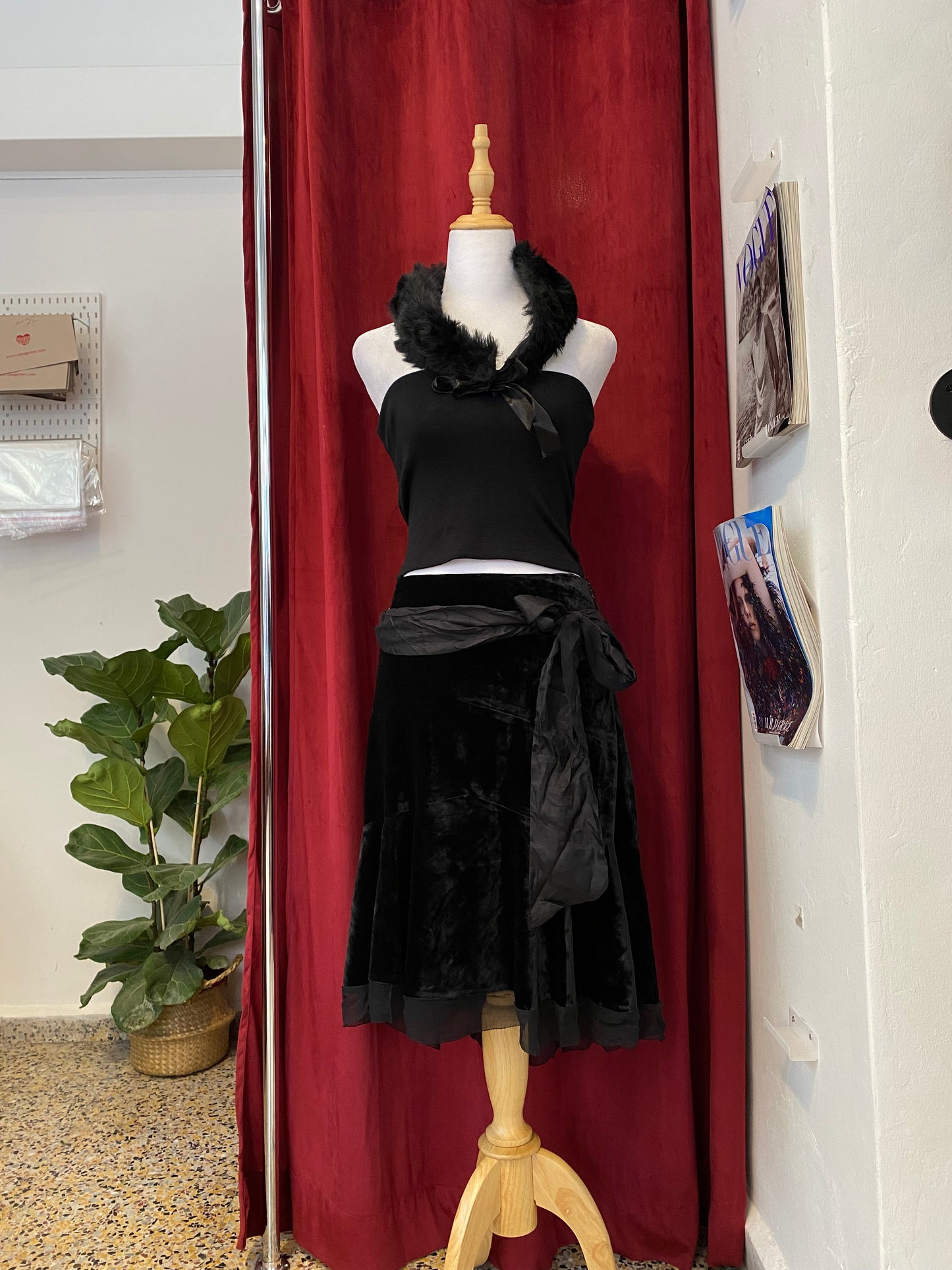 Black velvet midi skirt with complementary silk belt