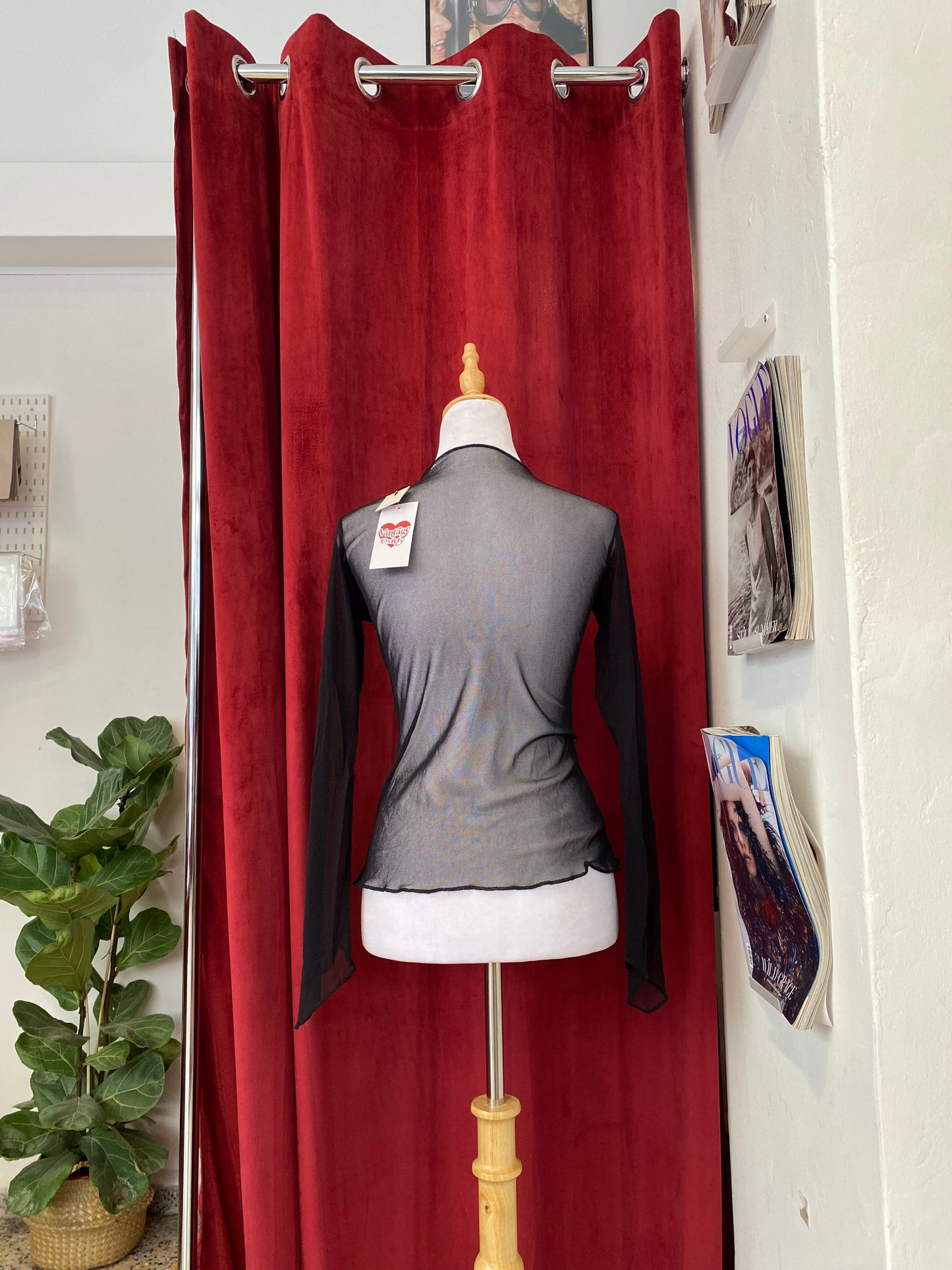 Sheer black top with rhinestone details