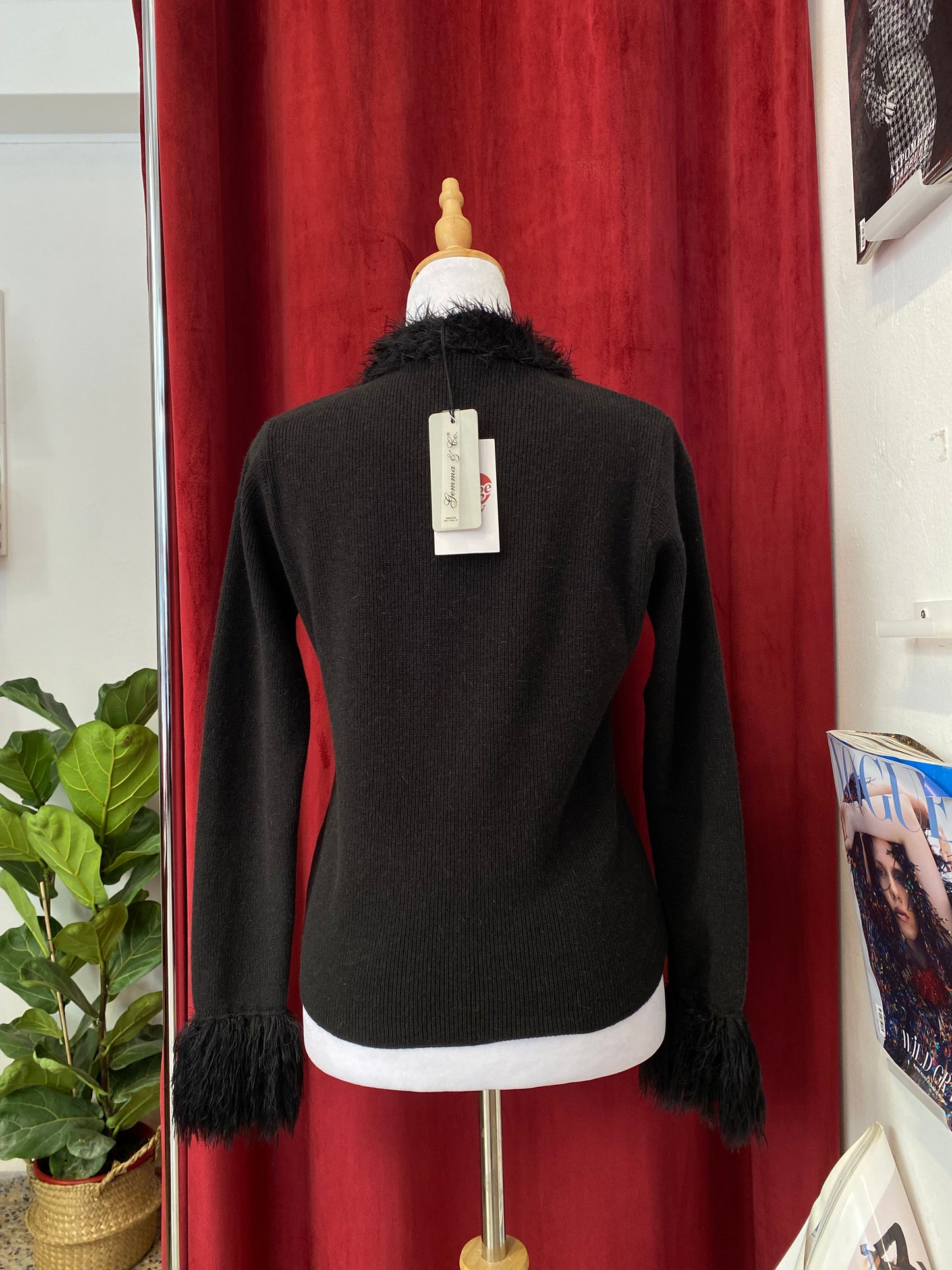 Black knitted top with fur details on collar and sleeves
