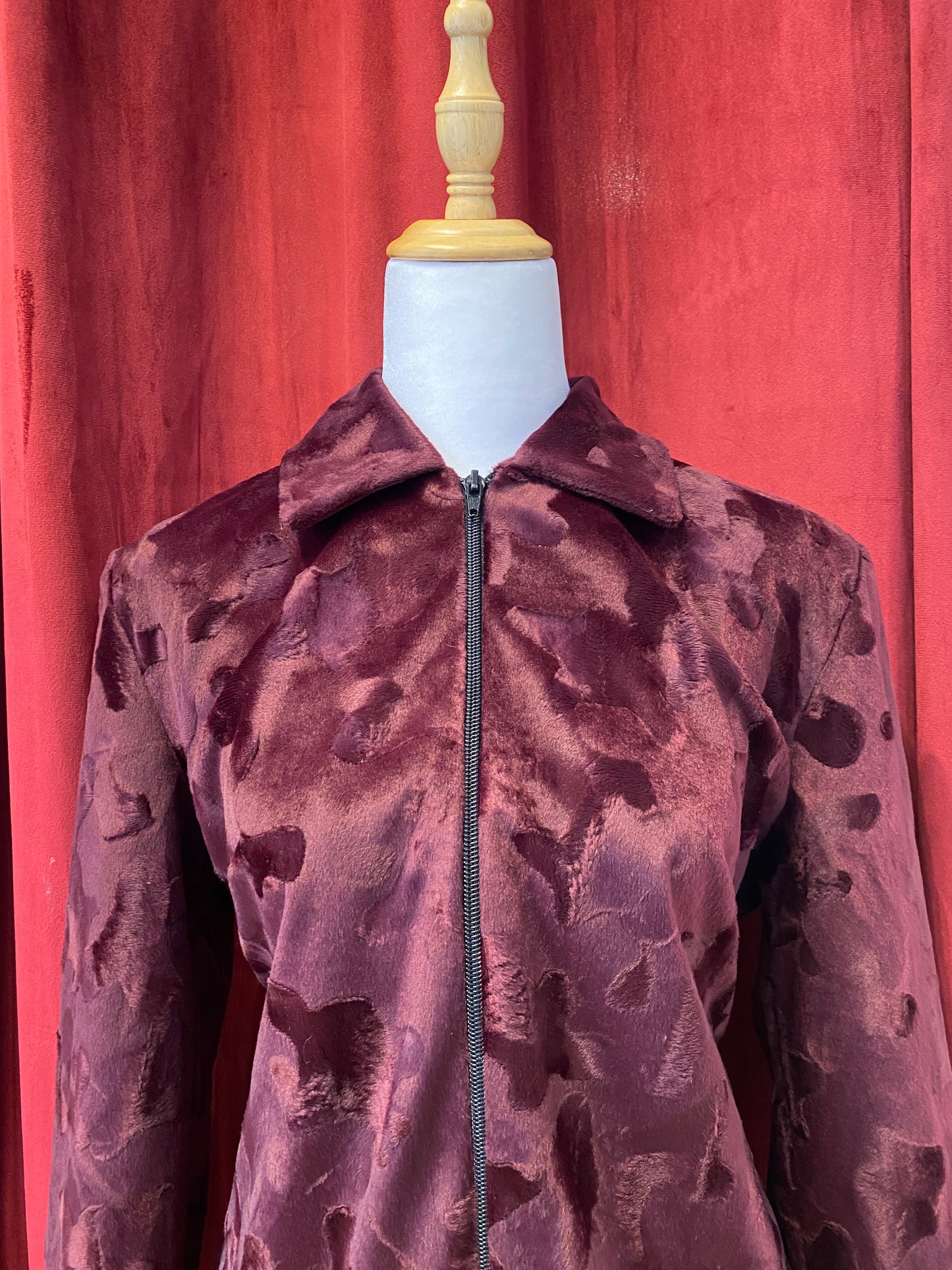 Deep burgundy faux fur jacket with cow print details