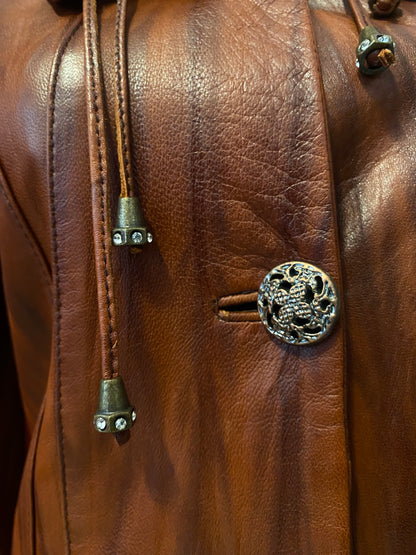 Elegant brown leather coat with intricate details 🥃