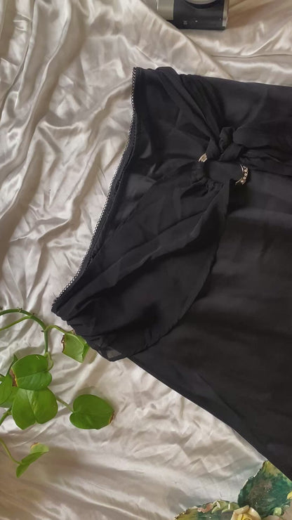 Brand new black satin skirt with buckle detail