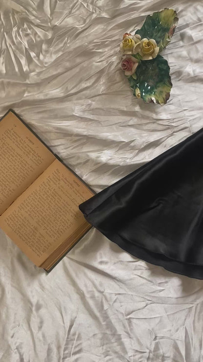 Brand new black satin mini skirt